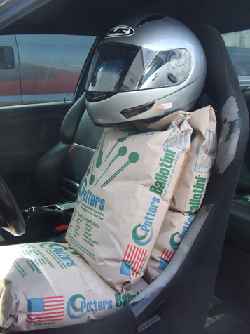 Sand bags in driver seat to mimic weight of driver for Center of Gravity Height Calculator